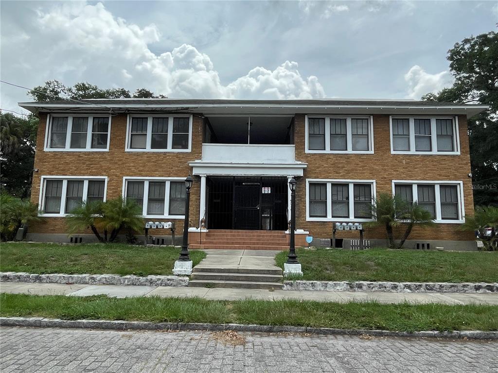 a front view of residential houses with yard