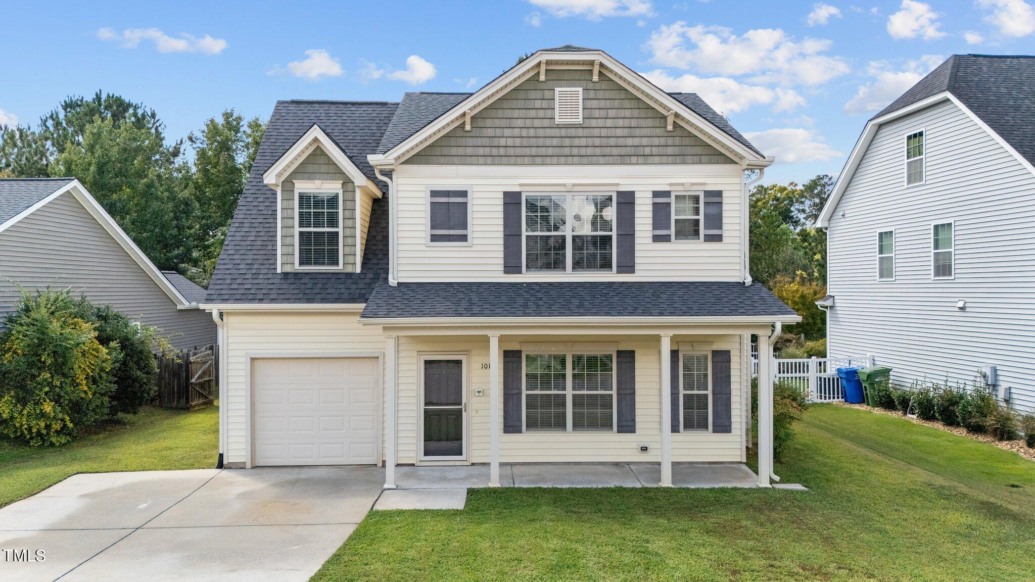 front view of a house with a yard