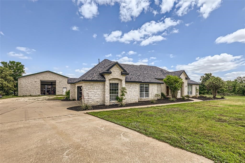 front view of a house with a yard