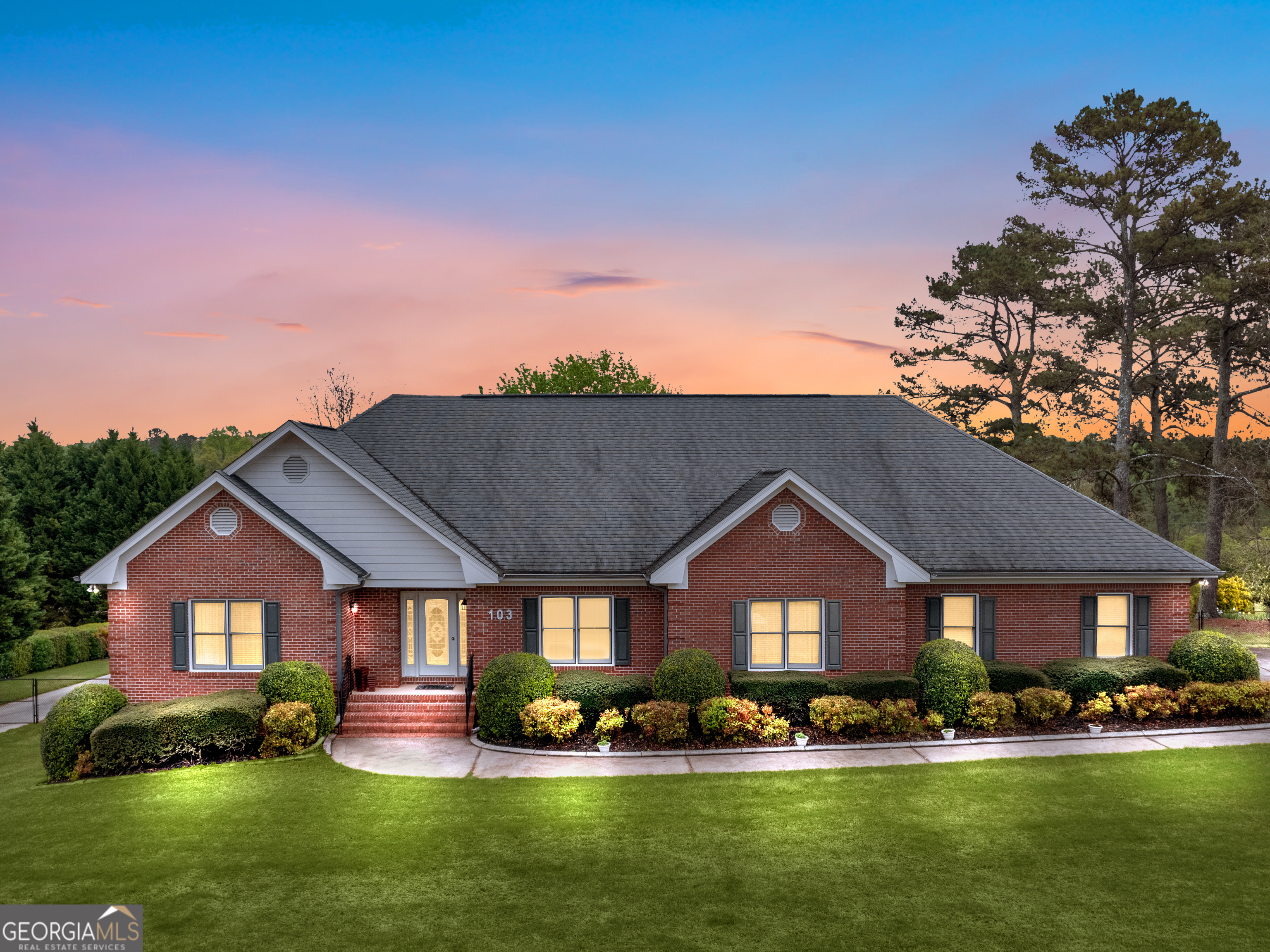 a front view of a house with a yard