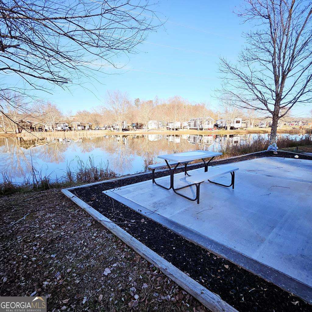 a view of a backyard with sitting area