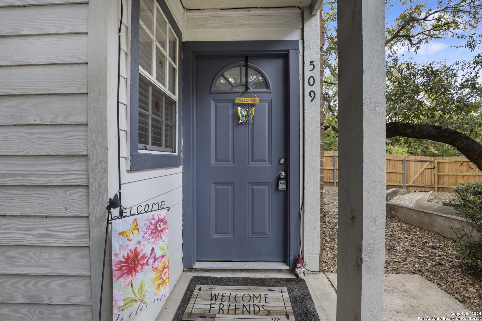 a front view of a house with a door and a window