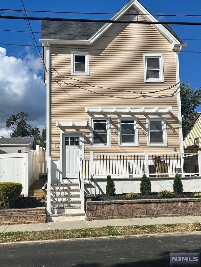 a view of a house with a small porch