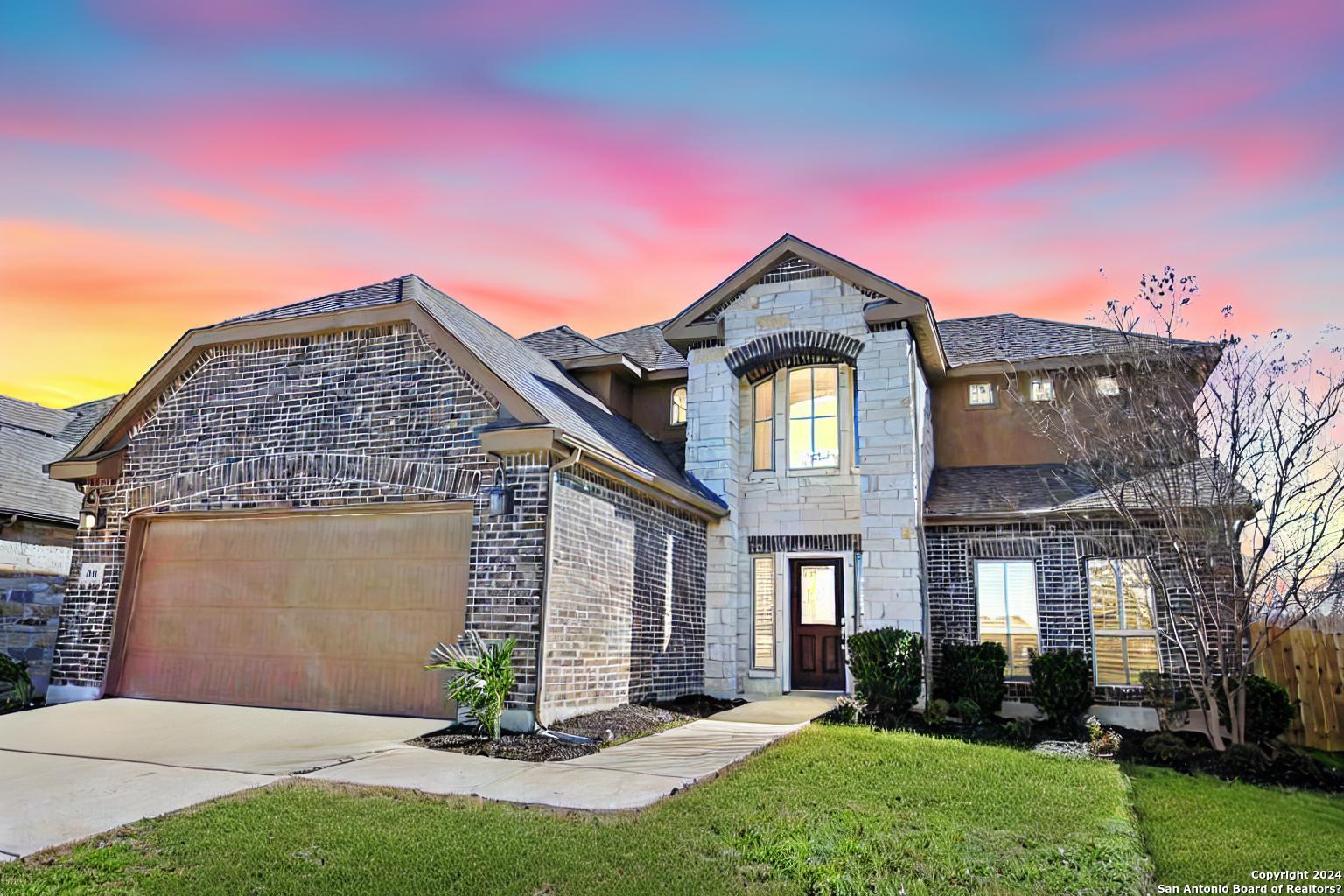 a front view of a house with a yard