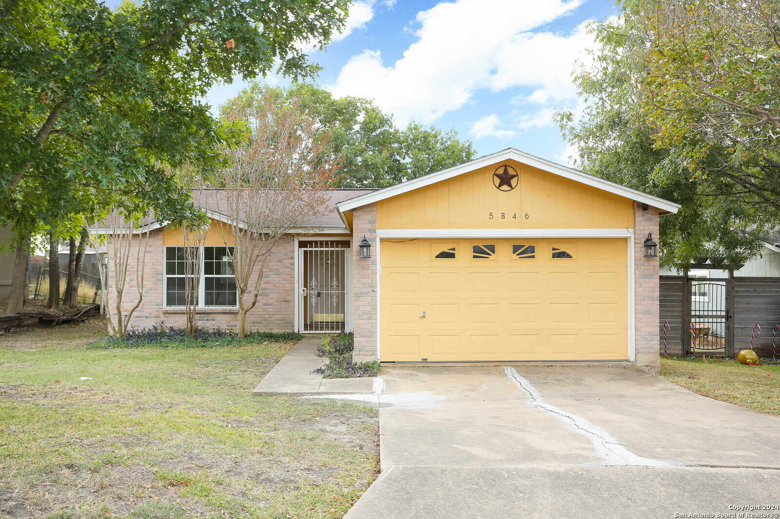 a front view of a house with a garage