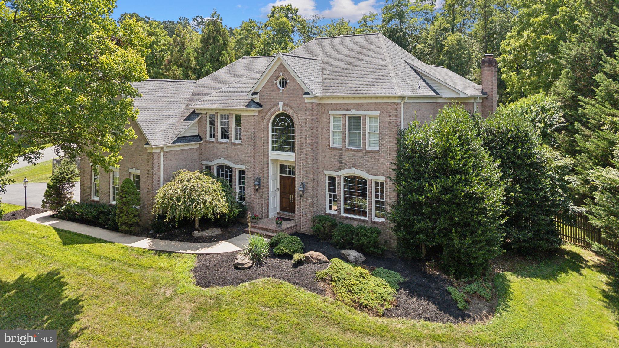 a aerial view of a house with swimming pool and garden