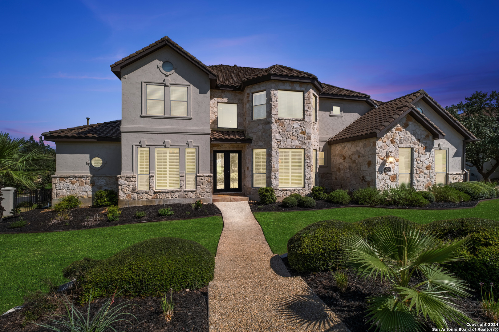 a front view of a house with a yard