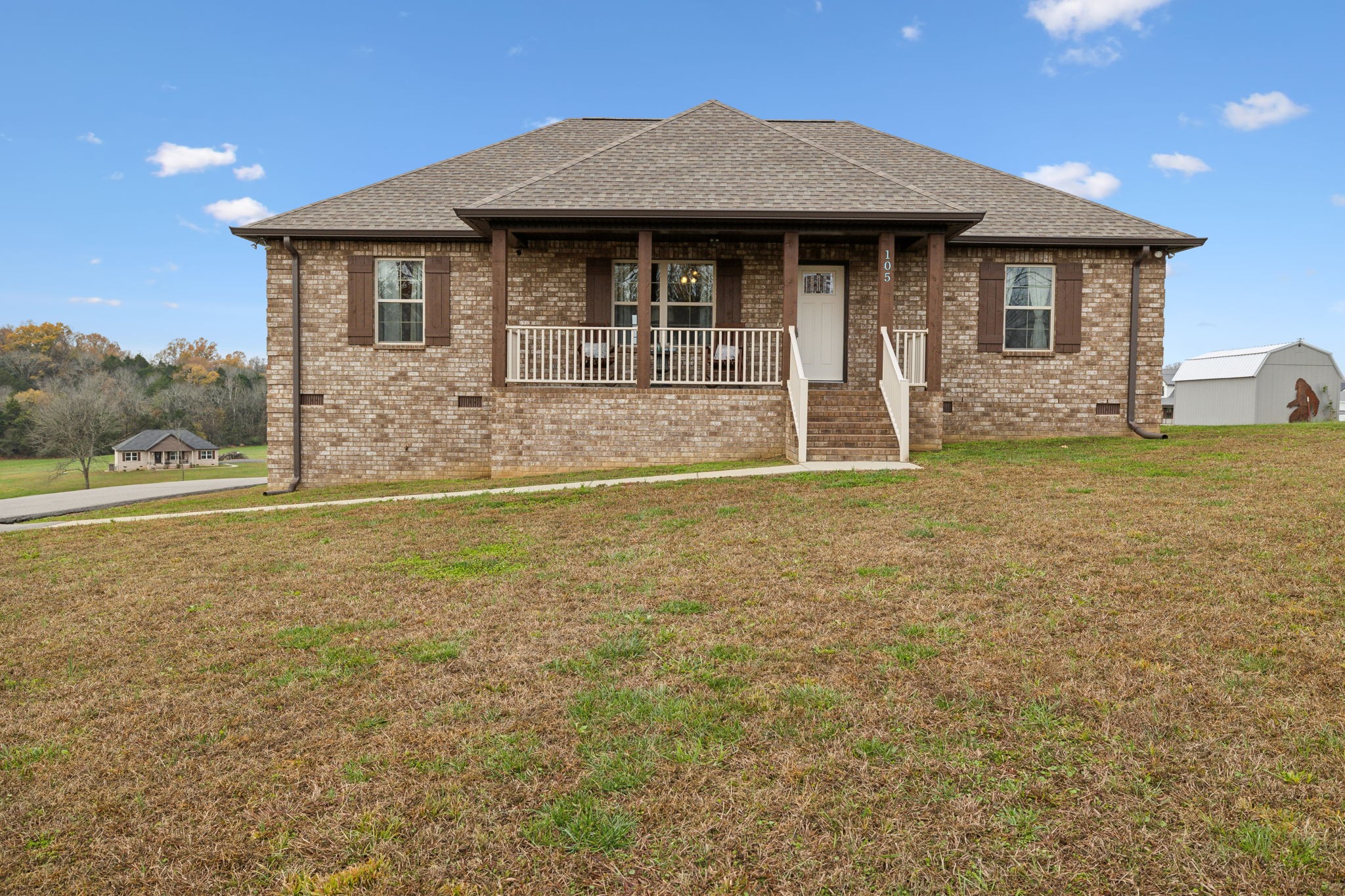 a front view of a house with a yard