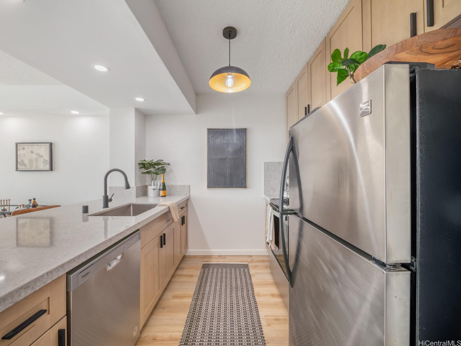 a view of a kitchen with a sink and dishwasher