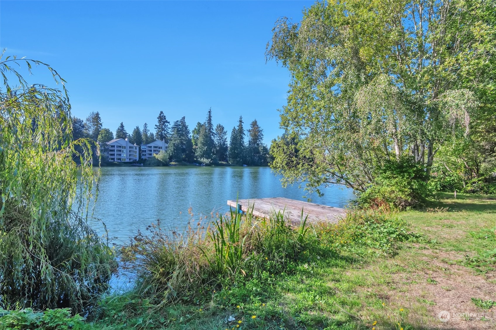 a view of a lake with a big yard