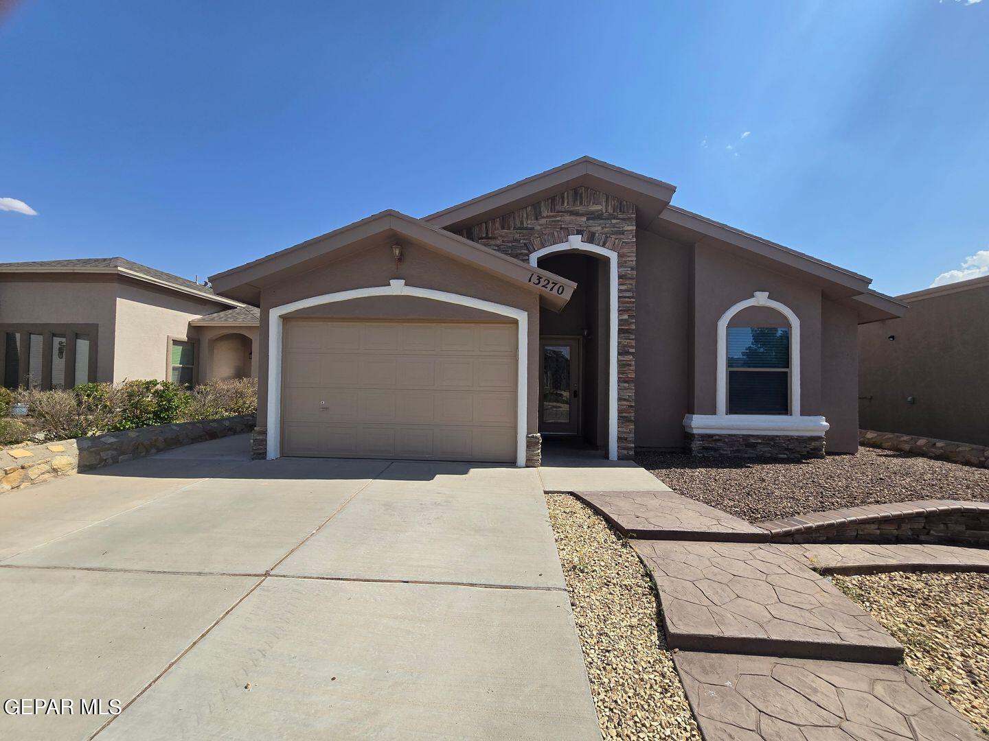 a front view of a house with yard