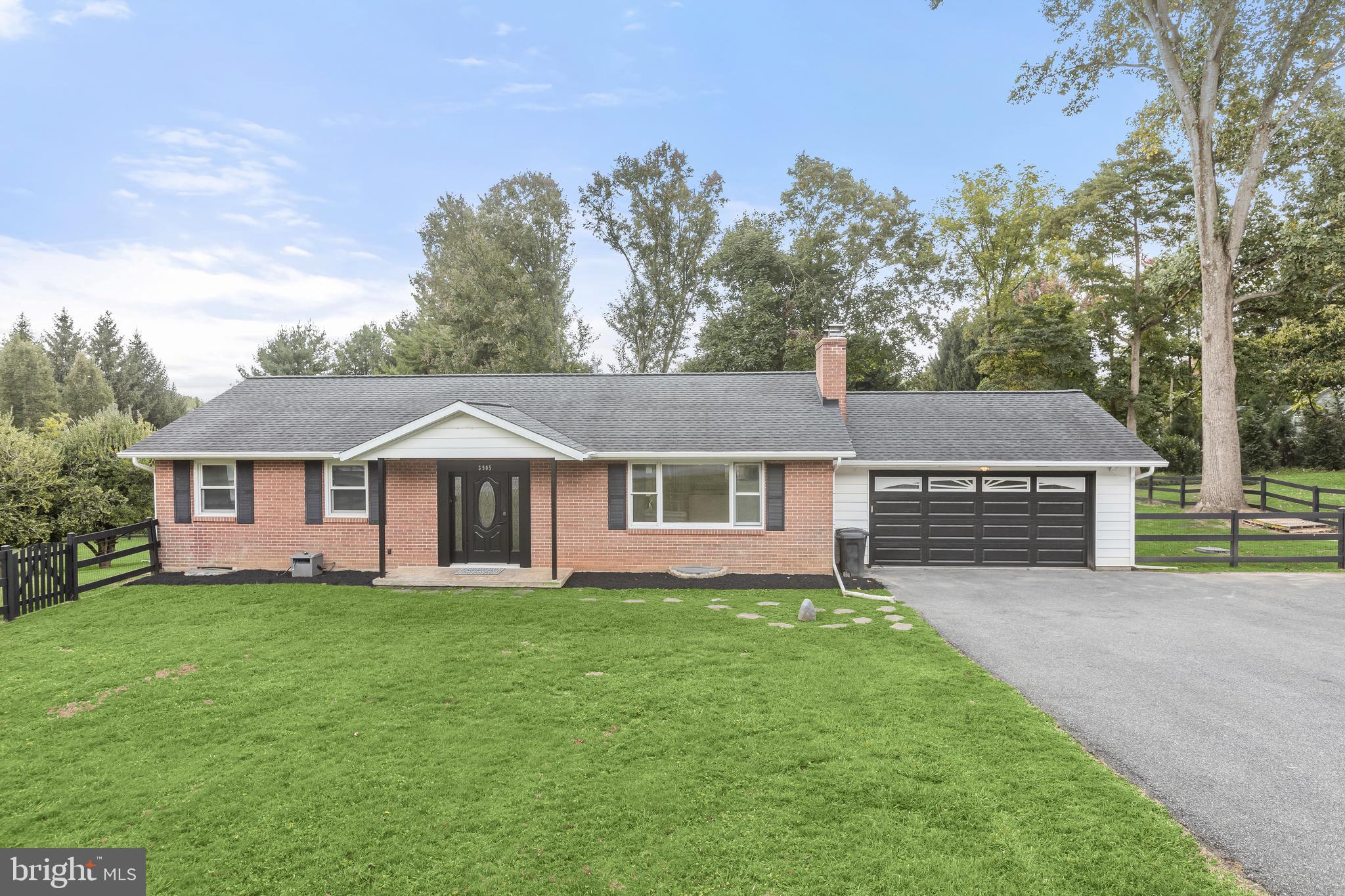 front view of a house with a yard