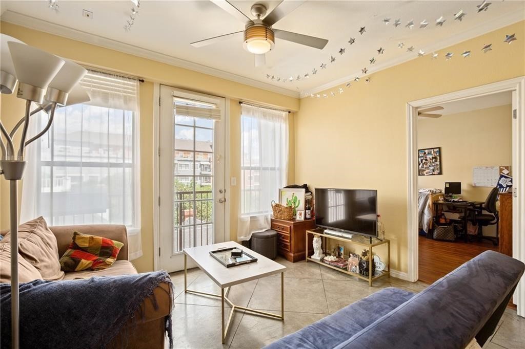 a living room with furniture and a flat screen tv