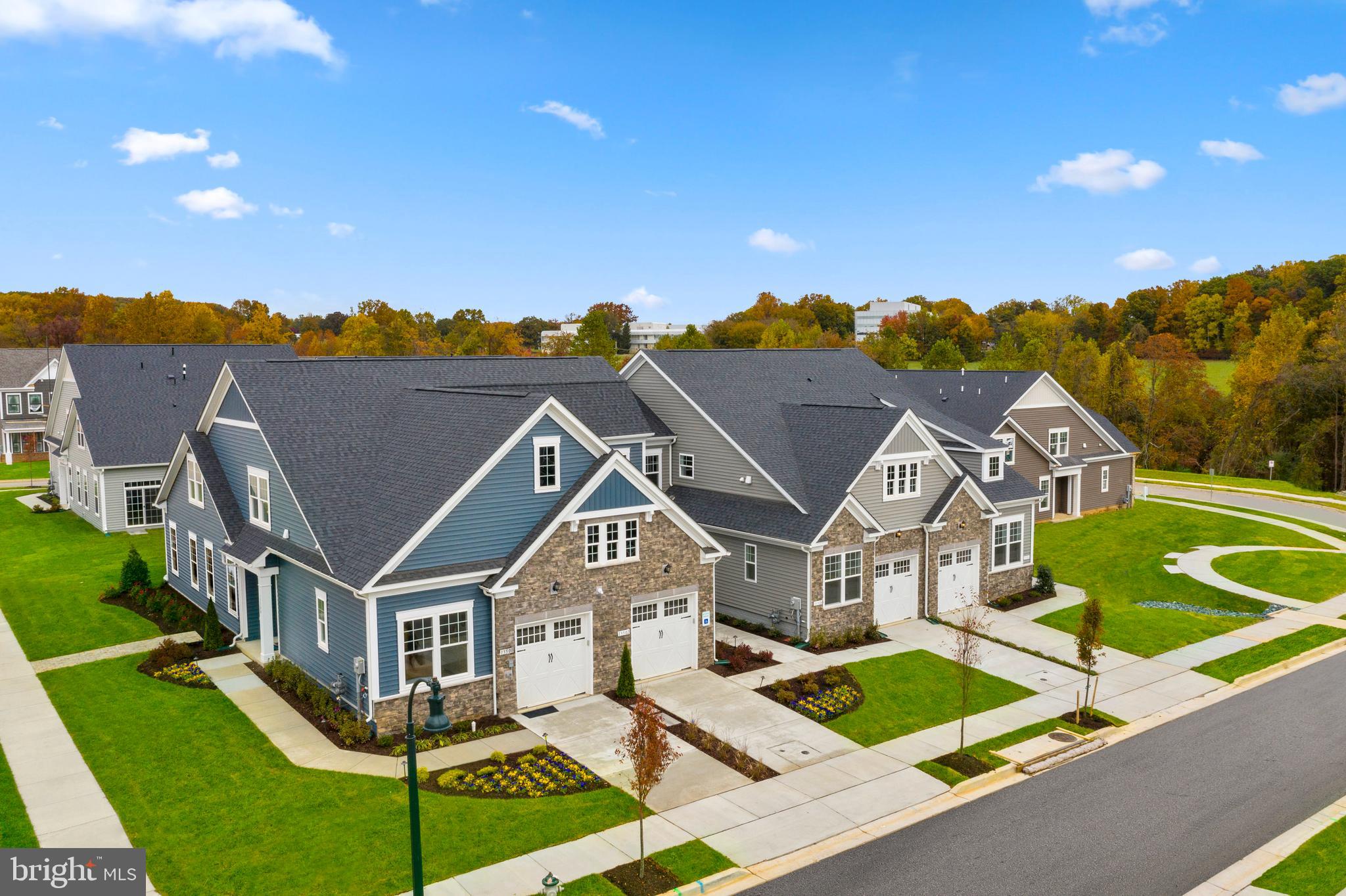 a front view of a house with a big yard