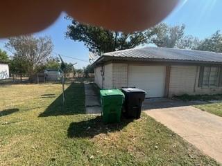 a view of a backyard of the house