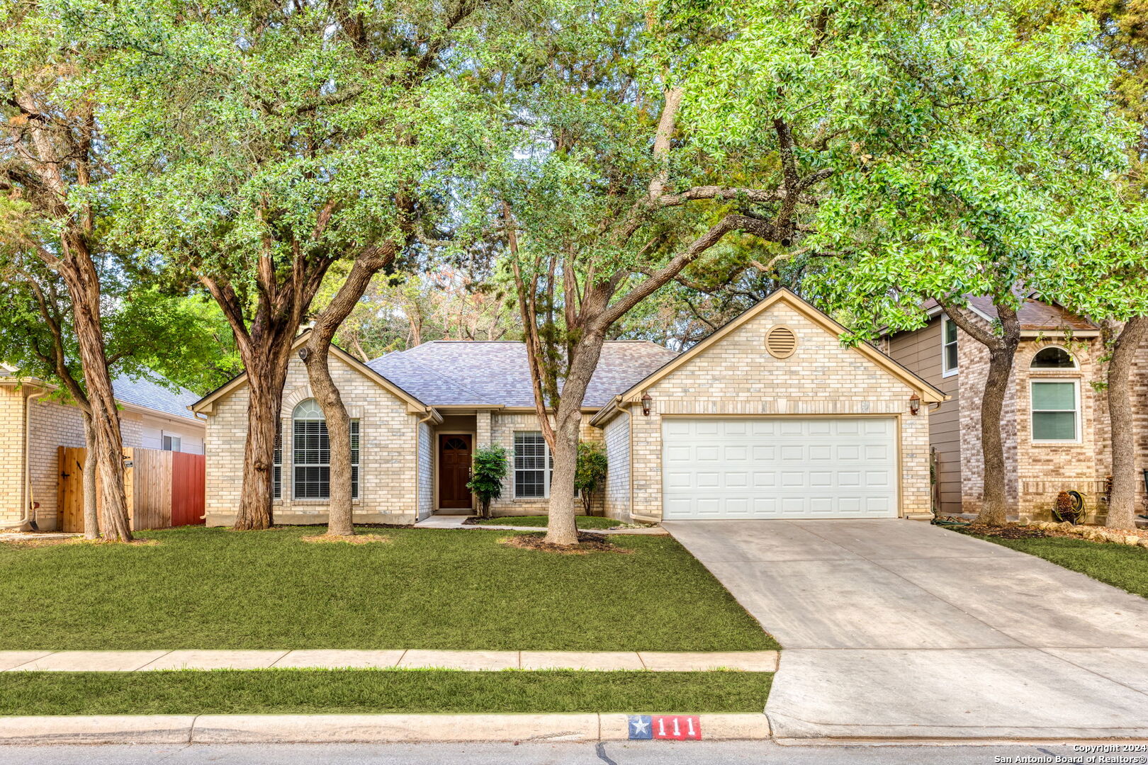 front view of a house and a yard