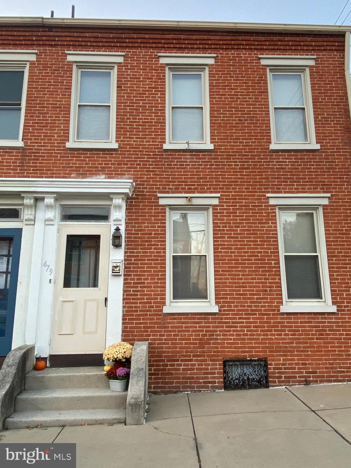 a brick building that has a large window in it