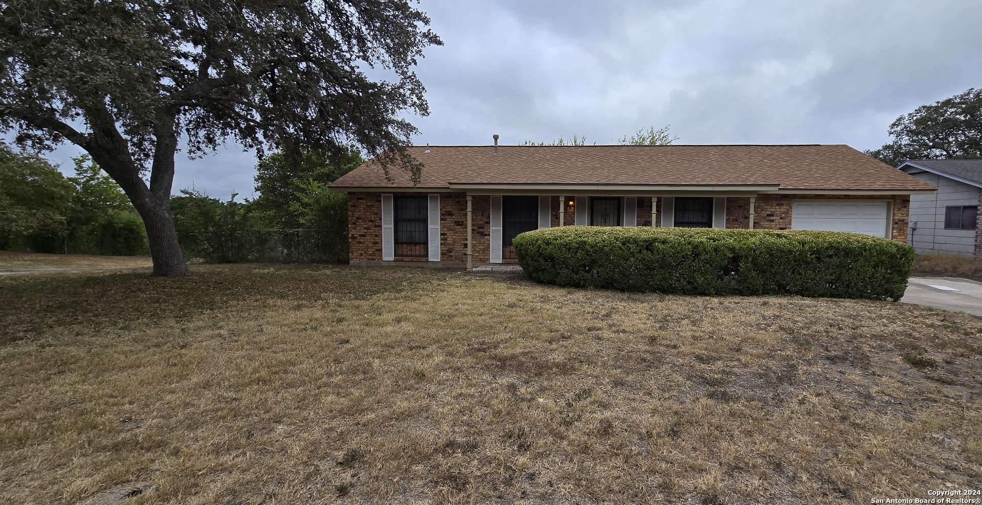 front view of a house with a dry yard