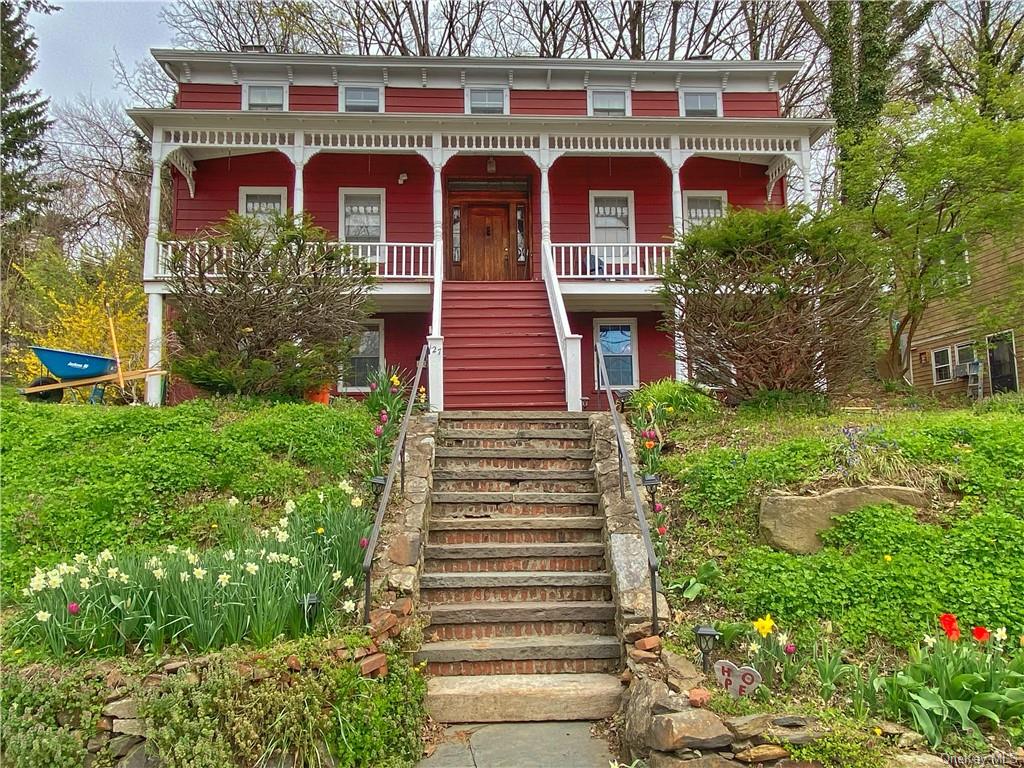 a front view of a residential apartment building with a yard