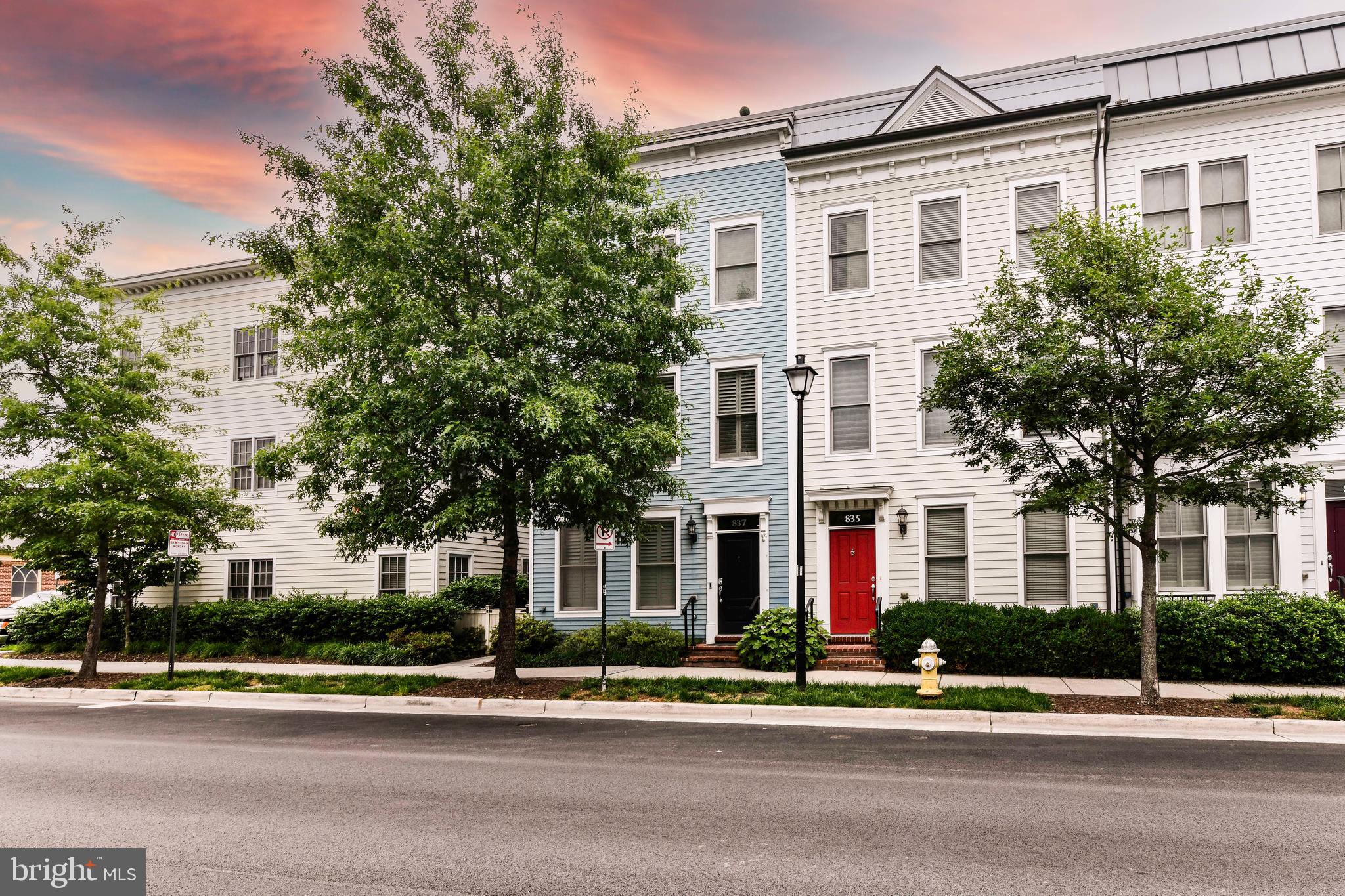 outdoor view of a white house with a street