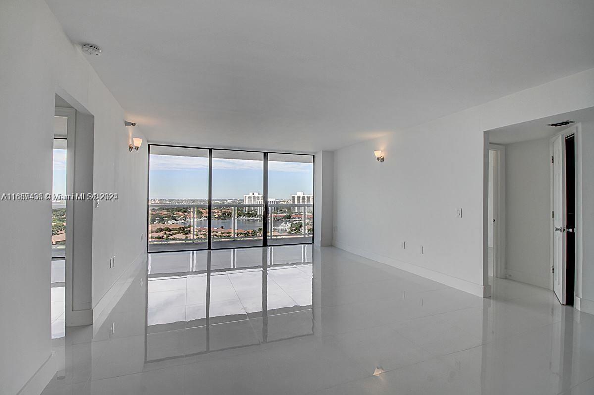 a view of empty room with windows