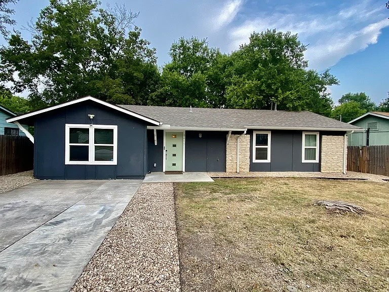 front view of a house with a yard