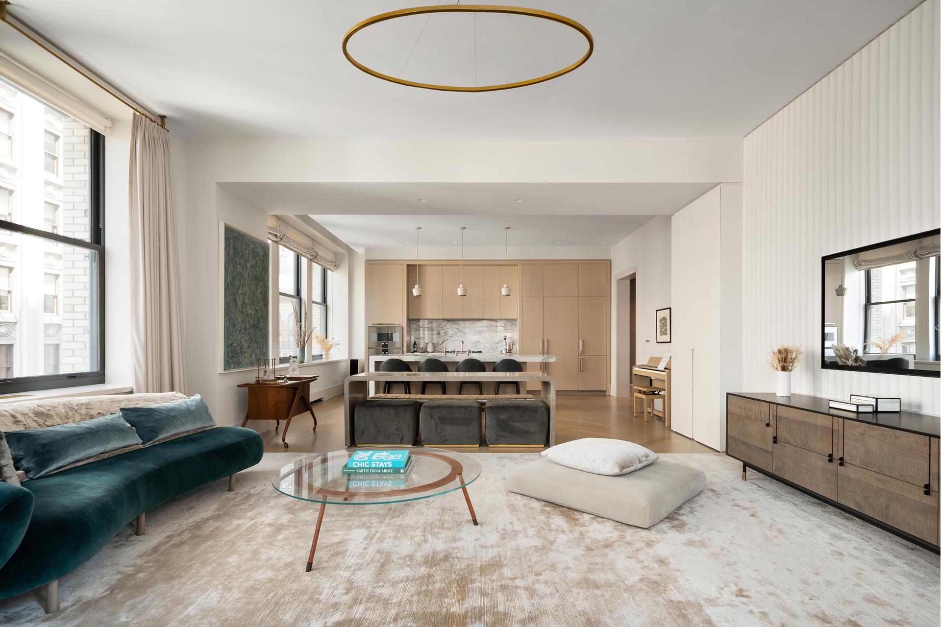 a living room with granite countertop furniture a rug a fireplace and a large window