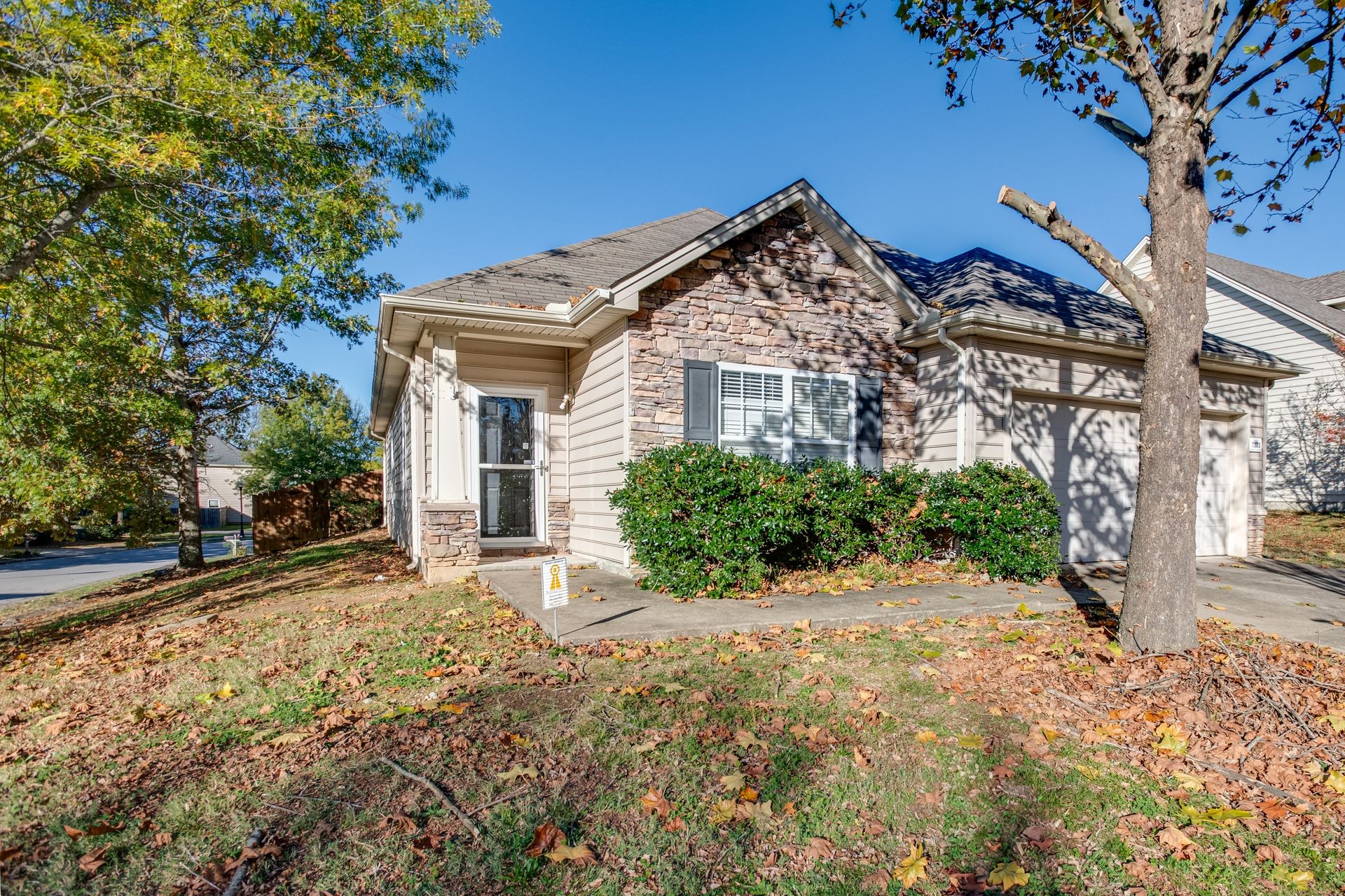 front view of a house with a yard