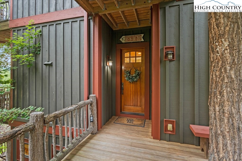 a view of a wooden house with a glass door