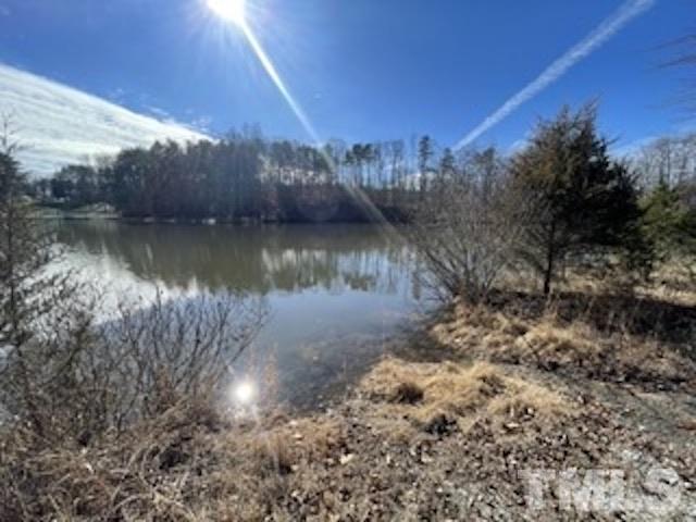 a view of a lake with a yard