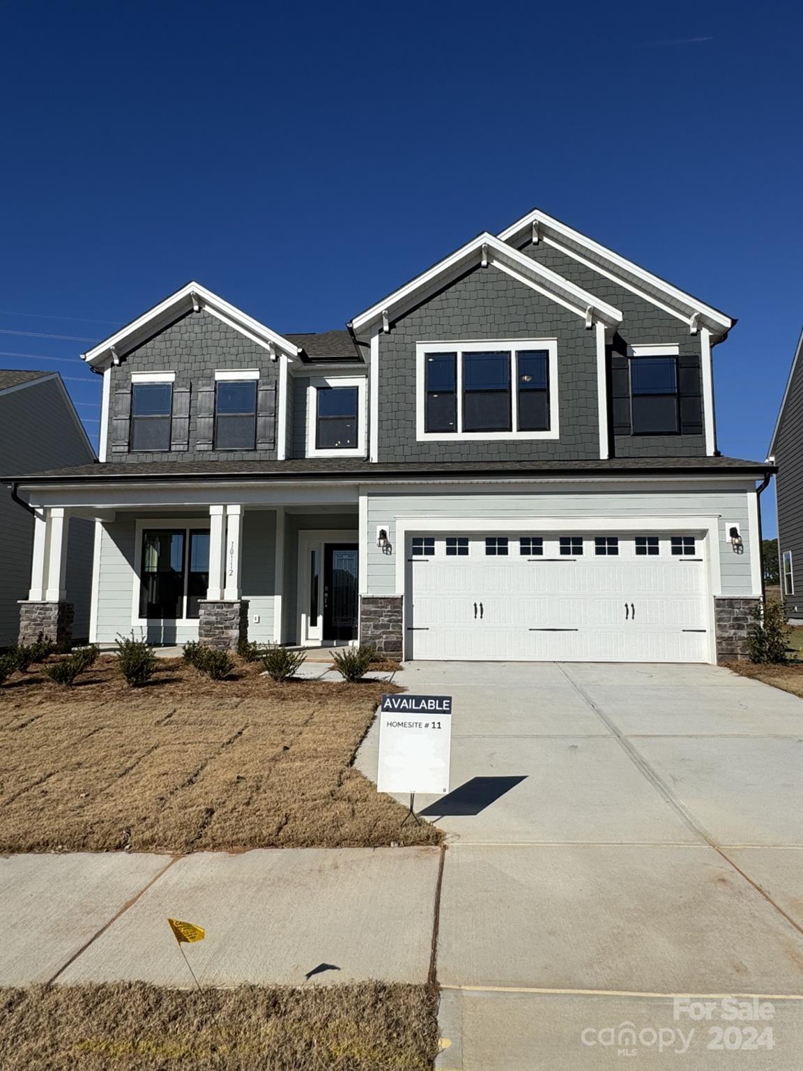 a front view of a house with yard