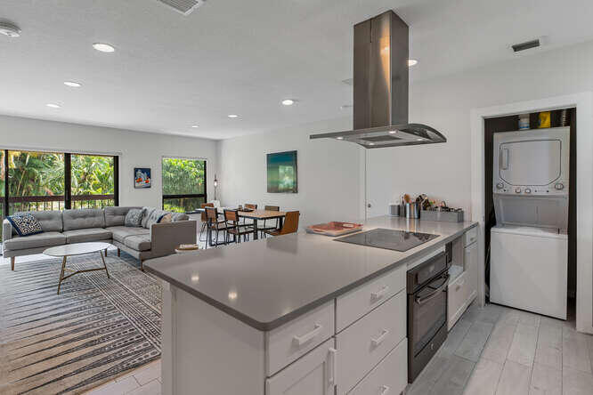 a view of a kitchen counter space and windows