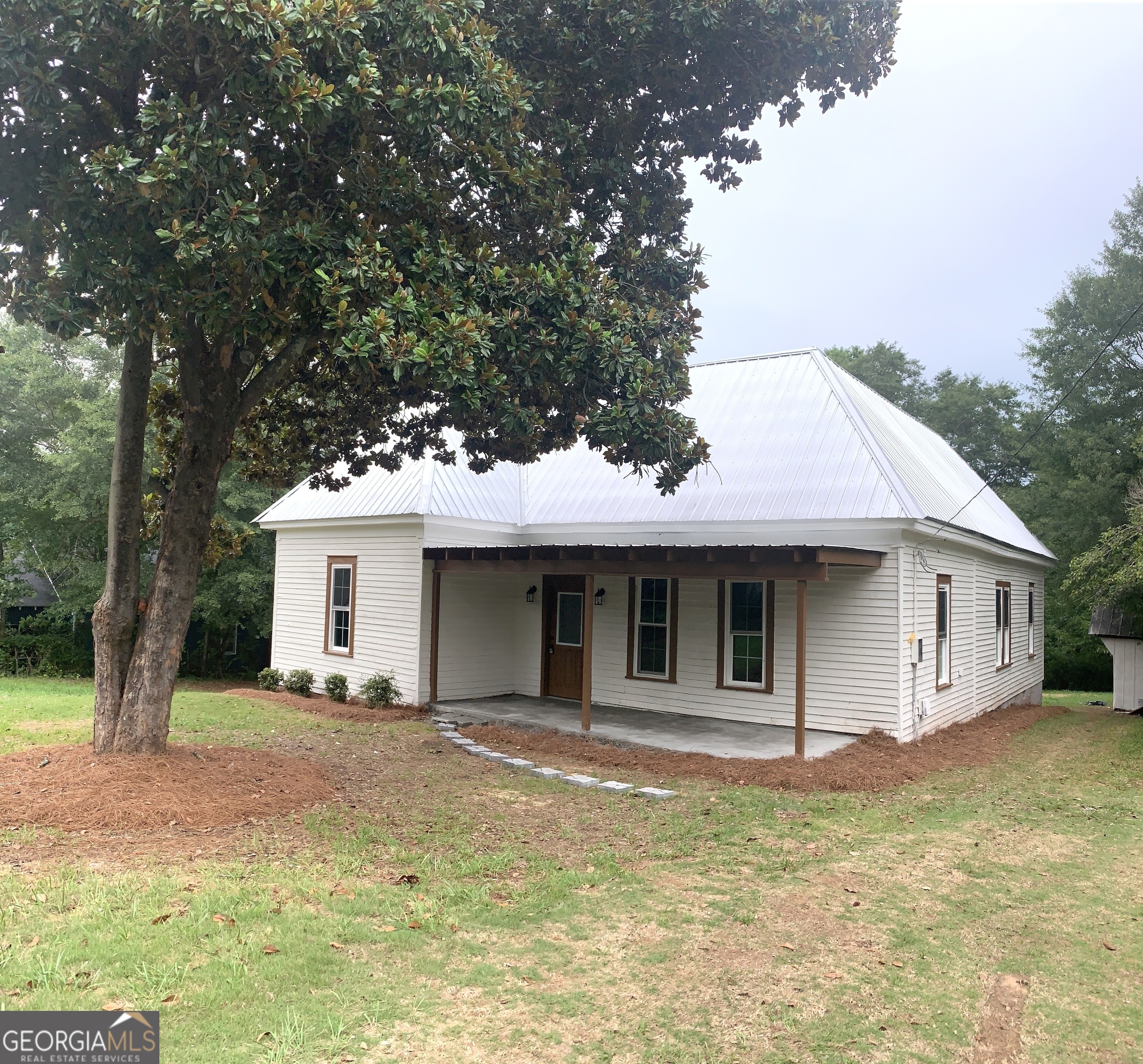 a house with trees in the background