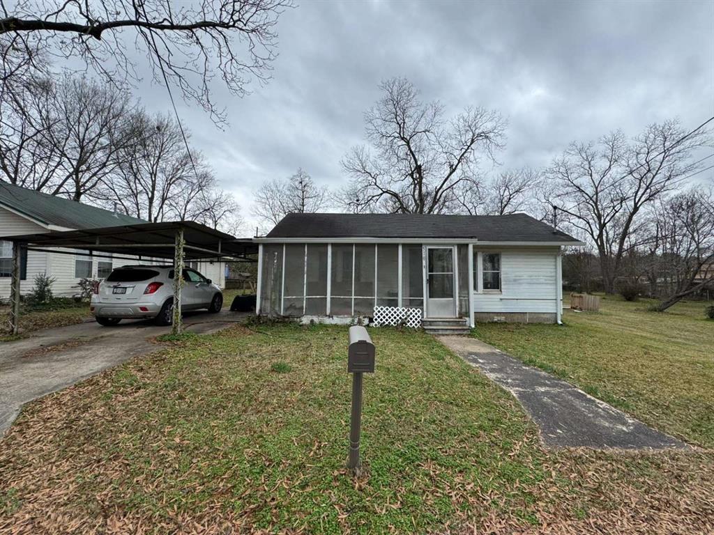 a front view of a house with a yard and porch