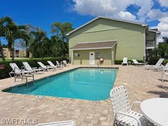 a view of a house with a yard patio and sitting area