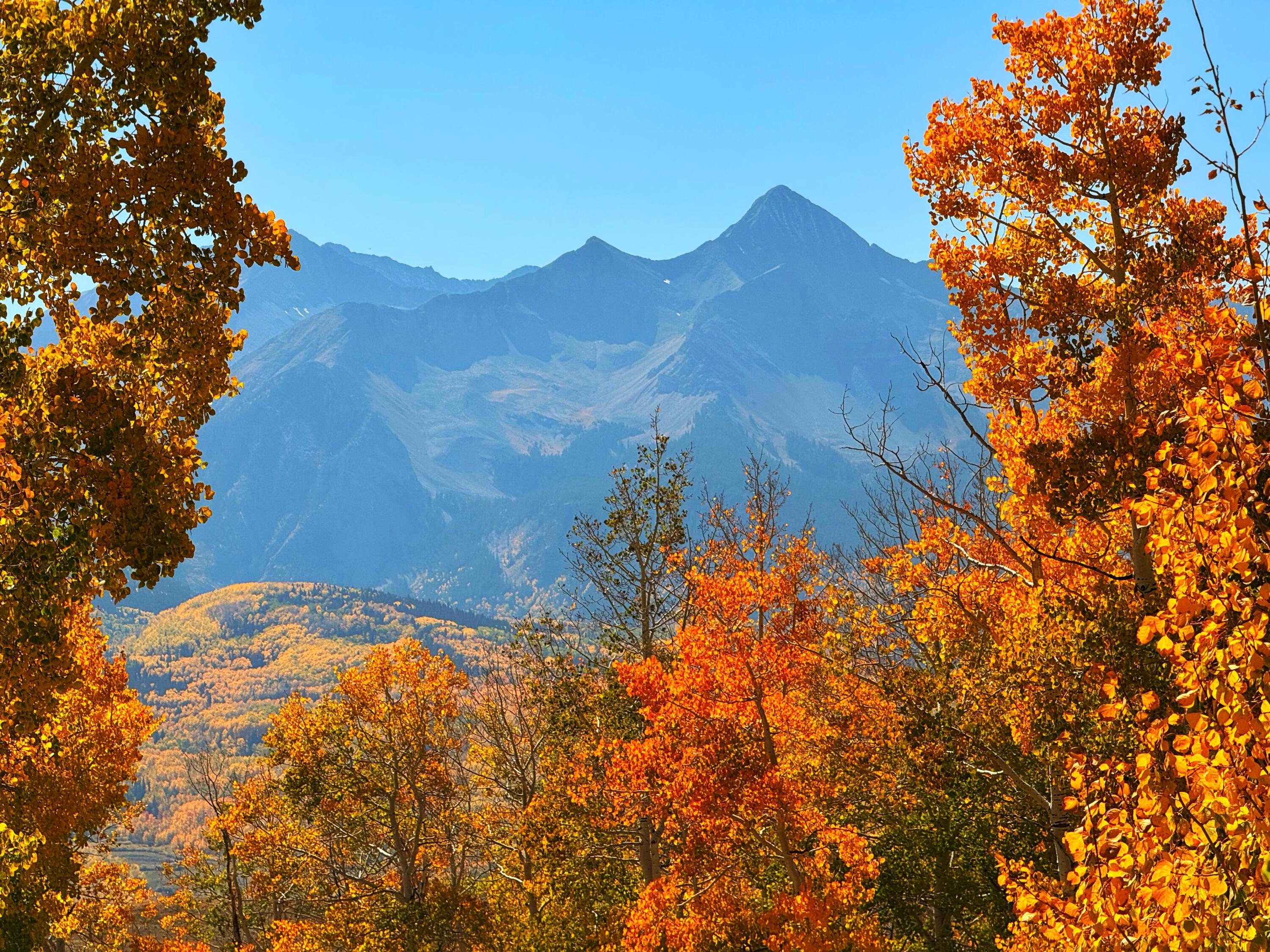 a view of a house with a mountain in the background