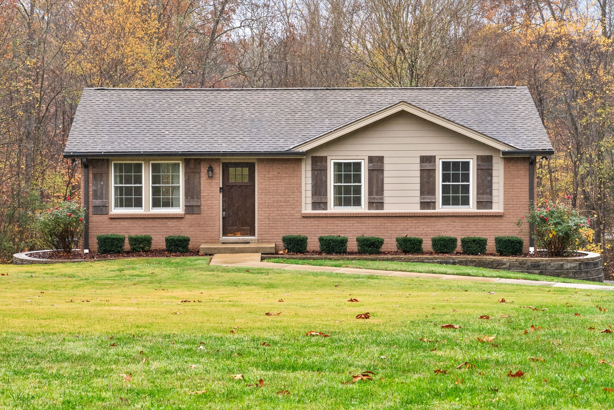 a front view of a house with a yard