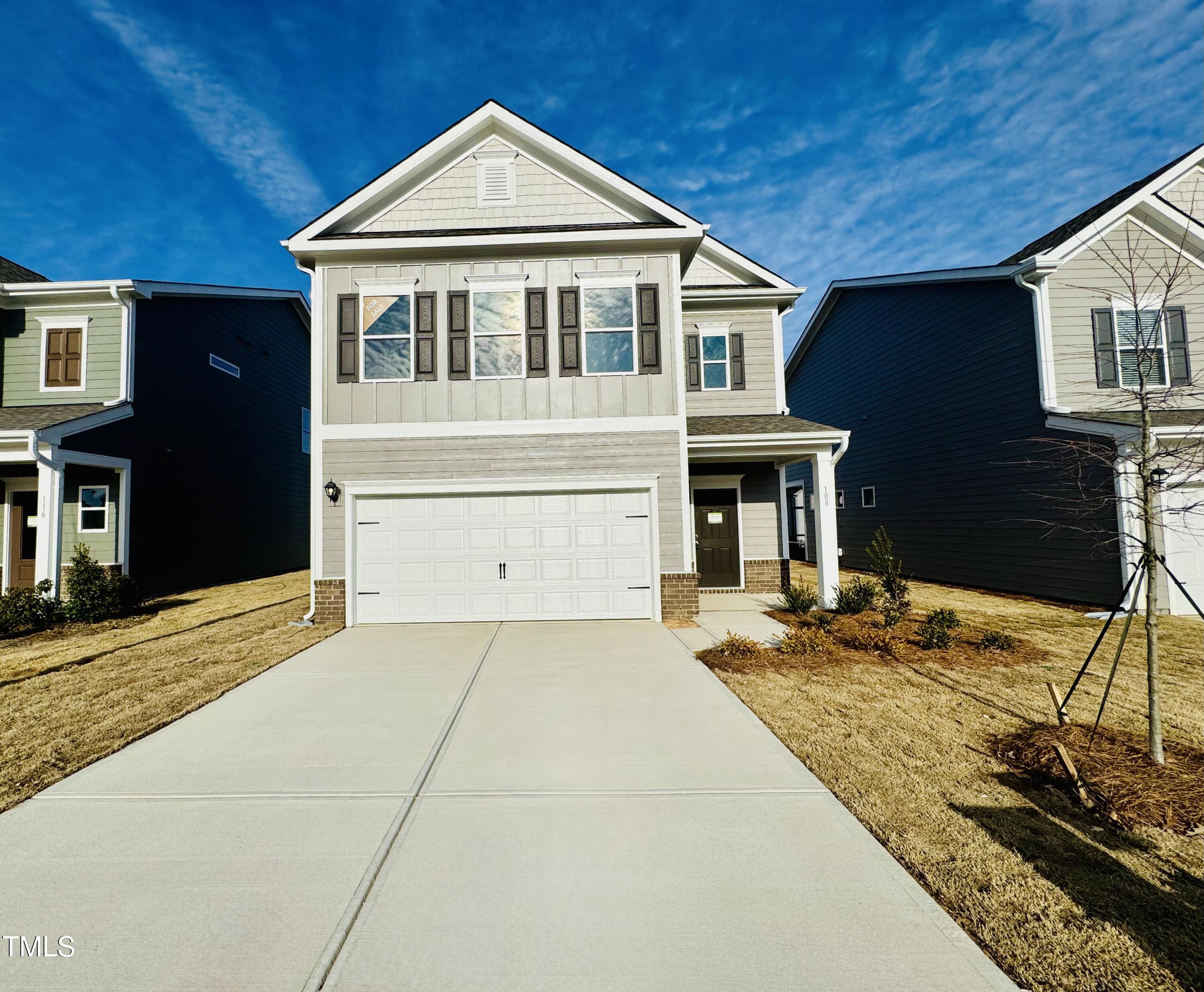 a front view of a house with a garage