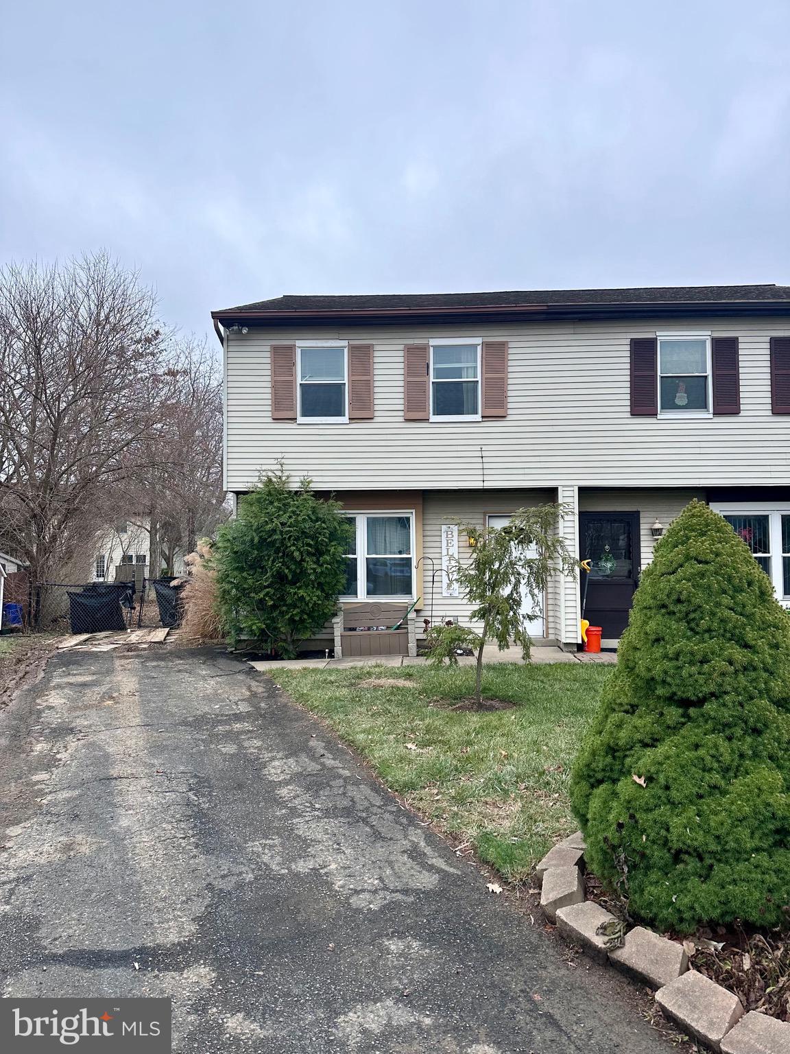 a front view of house with yard and outdoor seating