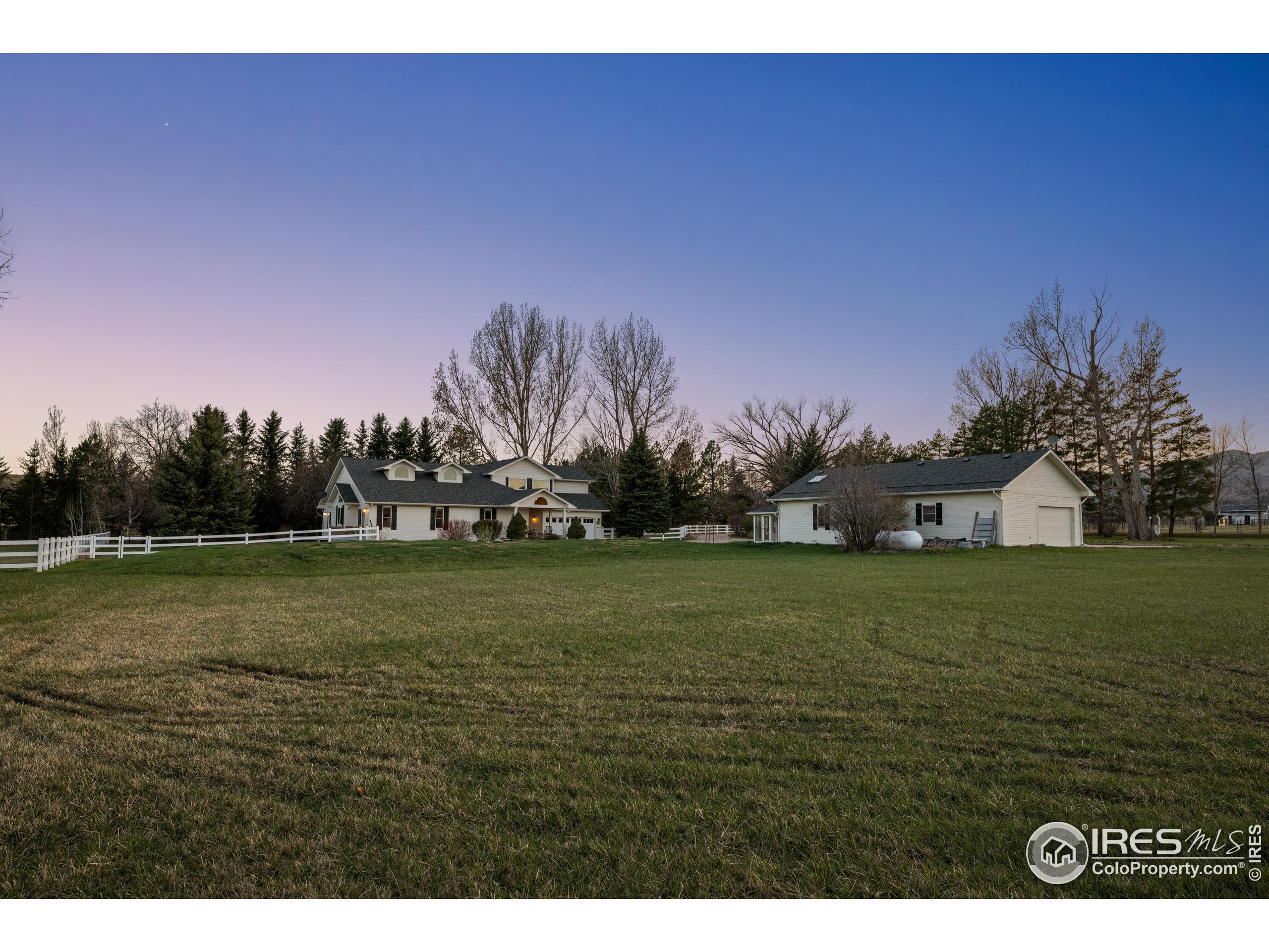 a view of a big yard with a house