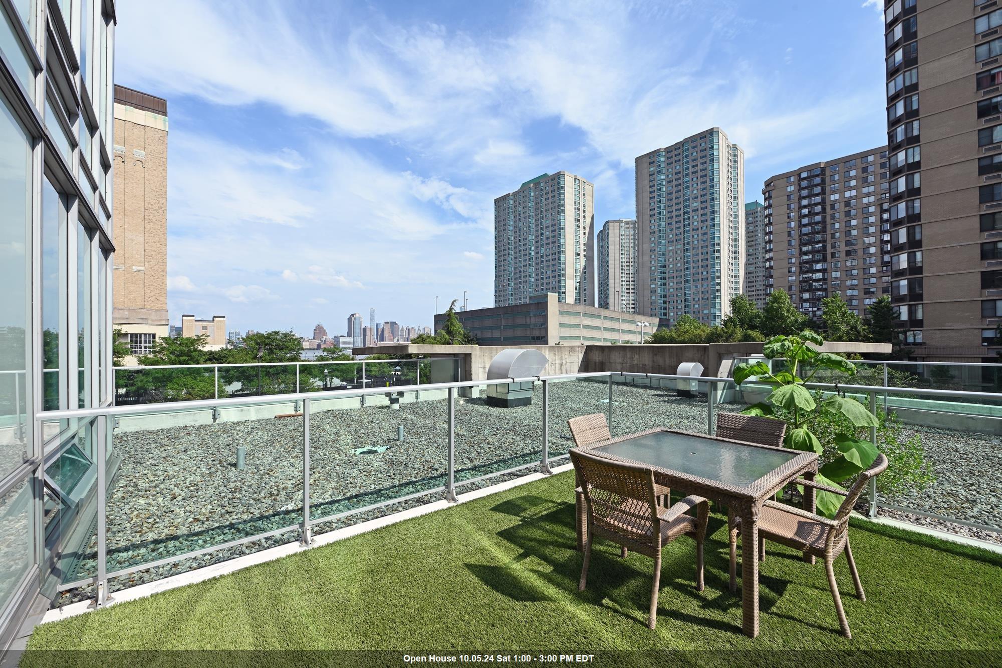 a view of balcony with outdoor seating and city view