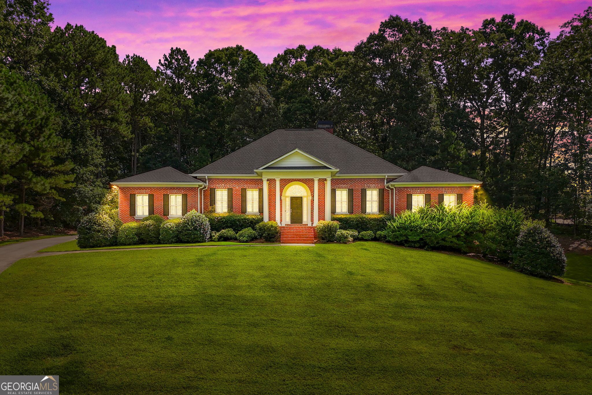 a front view of a house with a yard