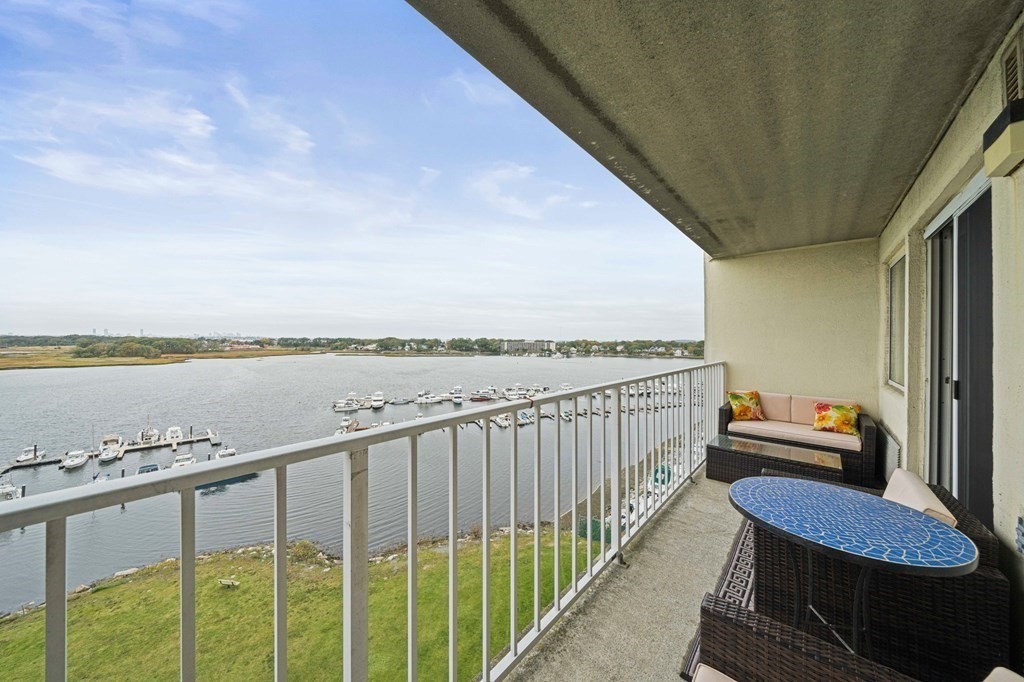 a balcony with an outdoor seating