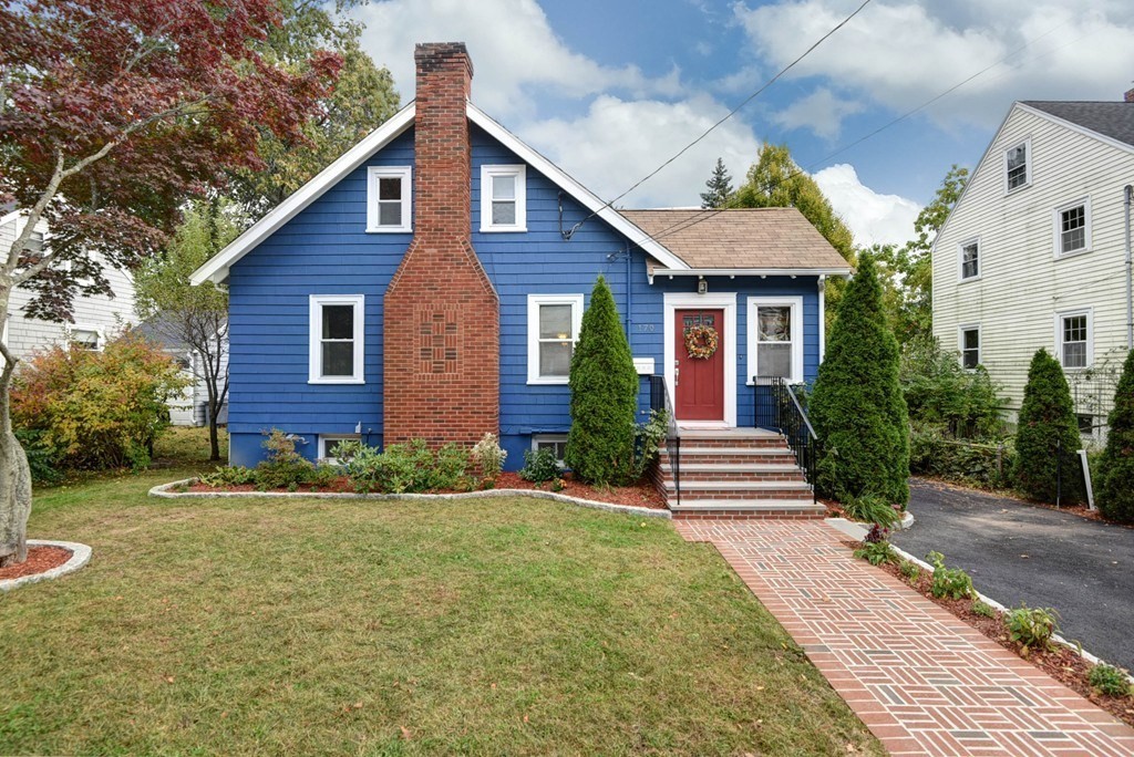 a front view of a house with a yard