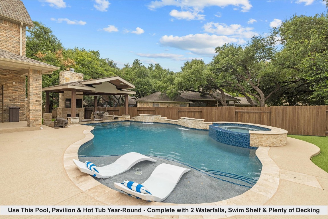 a view of a swimming pool with sitting area