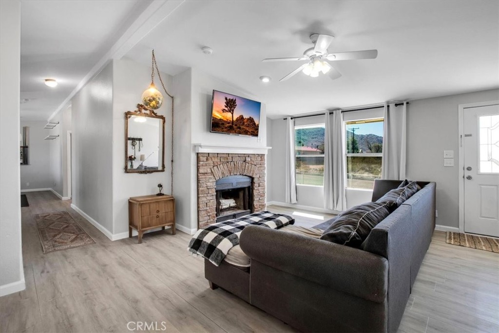 a living room with furniture fireplace and a flat screen tv