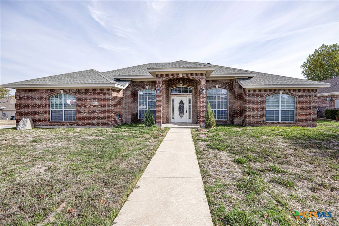 front view of a house with a yard