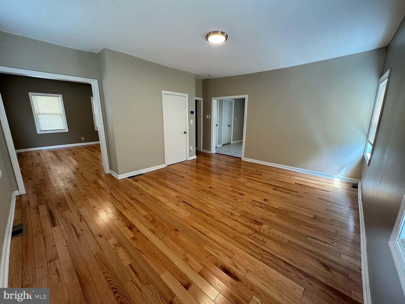 a view of a livingroom with wooden floor