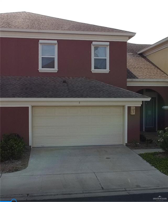 View of front facade featuring a garage