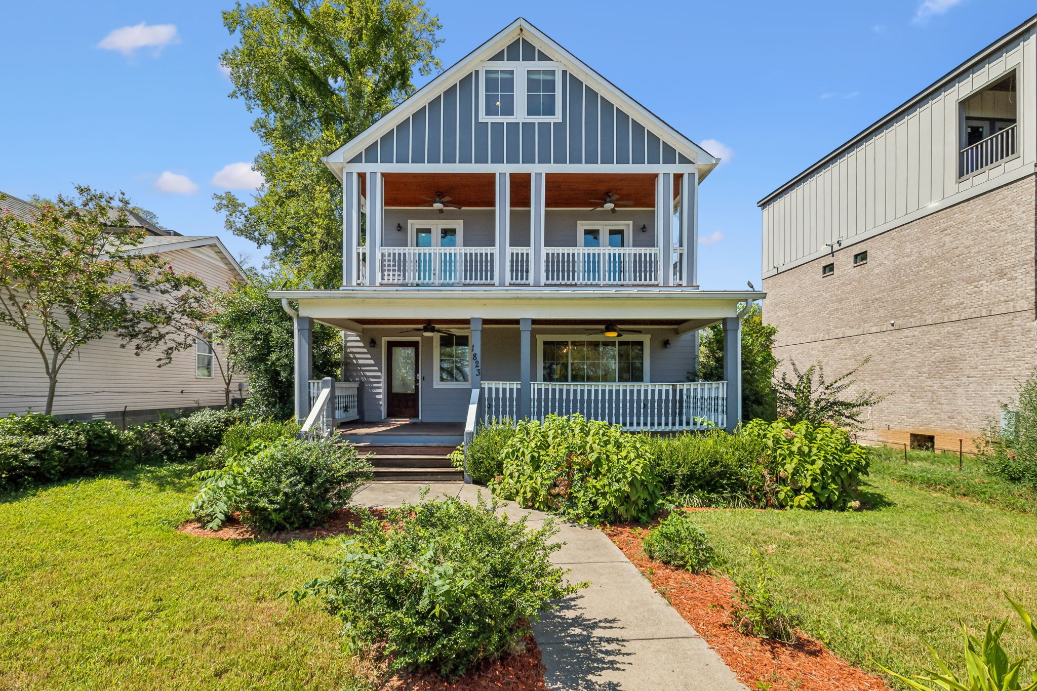 a front view of a house with a yard